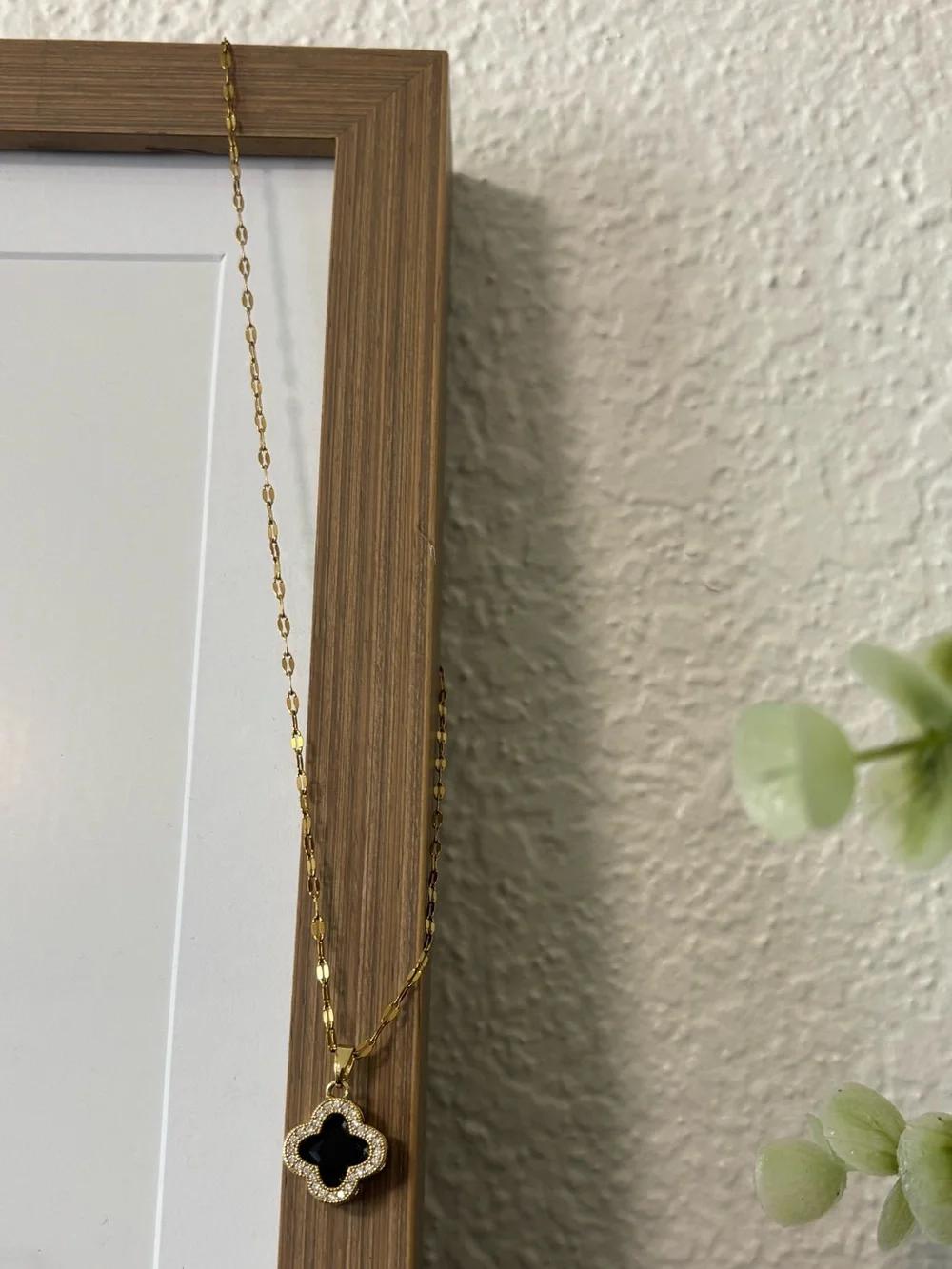 Gold Clover Pendant Necklace with Black Enamel